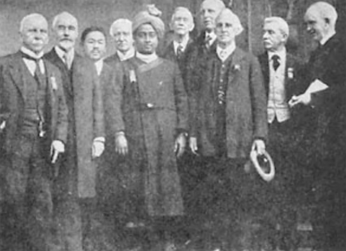 A group of delegates to the 1920 International Congress of Religious Liberals at Boston, where I gave my maiden speech in America. (Left to right) Rev. Clay MacCauley, Rev. T. Rhondda Williams, Prof. S. Ushigasaki, Rev. Jabez T. Sunderland, myself, Rev. Chas. W. Wendte, Rev. Samuel A. Eliot, Rev. Basil Martin, Rev. Christopher J. Street, Rev. Samuel M. Crothers.