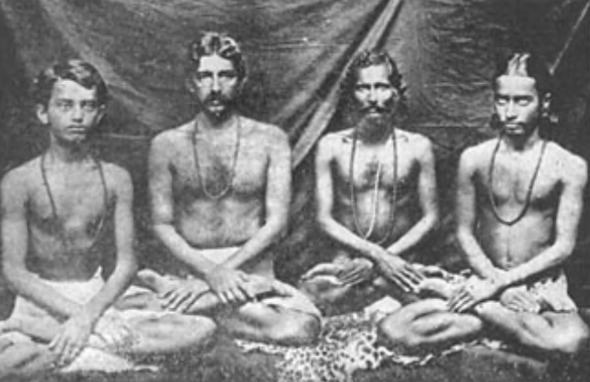 (Left to right) Jitendra Mazumdar, my companion on the “penniless test” at Brindaban; Lalit-da, my cousin; Swami Kebelananda (“Shastri Mahasaya”), my saintly Sanskrit tutor; myself, as a high school youth