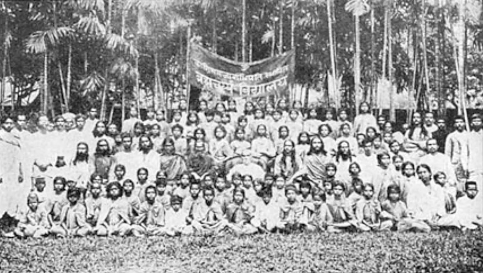 A group of Ranchi students and teachers pose with the venerable Maharaja of Kasimbazar (at center, in white). In 1918 he gave his Kasimbazar Palace and twenty-five acres in Ranchi as a permanent site for my yoga school for boys.