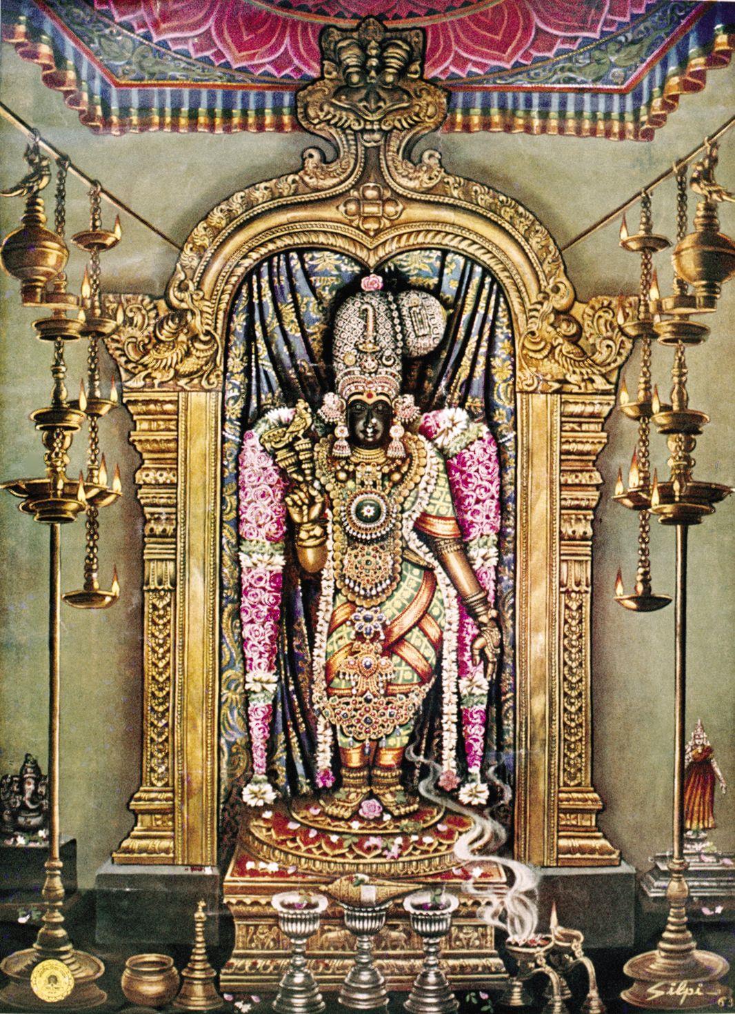 Colour painting of the standing image of Goddess Meenakshi, adorned with jewels and pink and white garlands, framed by a golden arch under a red and blue canopy, with tall brass oil lamps on both sides and offering vessels with rising incense smoke in front. Signed at lower right. Whole picture.