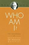 Orange book cover titled 'WHO AM I?' with a small oval portrait at the top; printed tilted on the page.