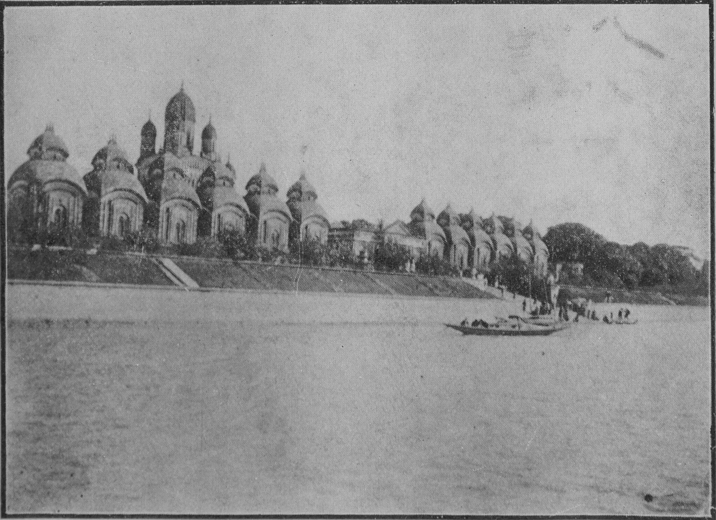 The temples at Dakshineswar seen across the Ganges, a boat in the foreground