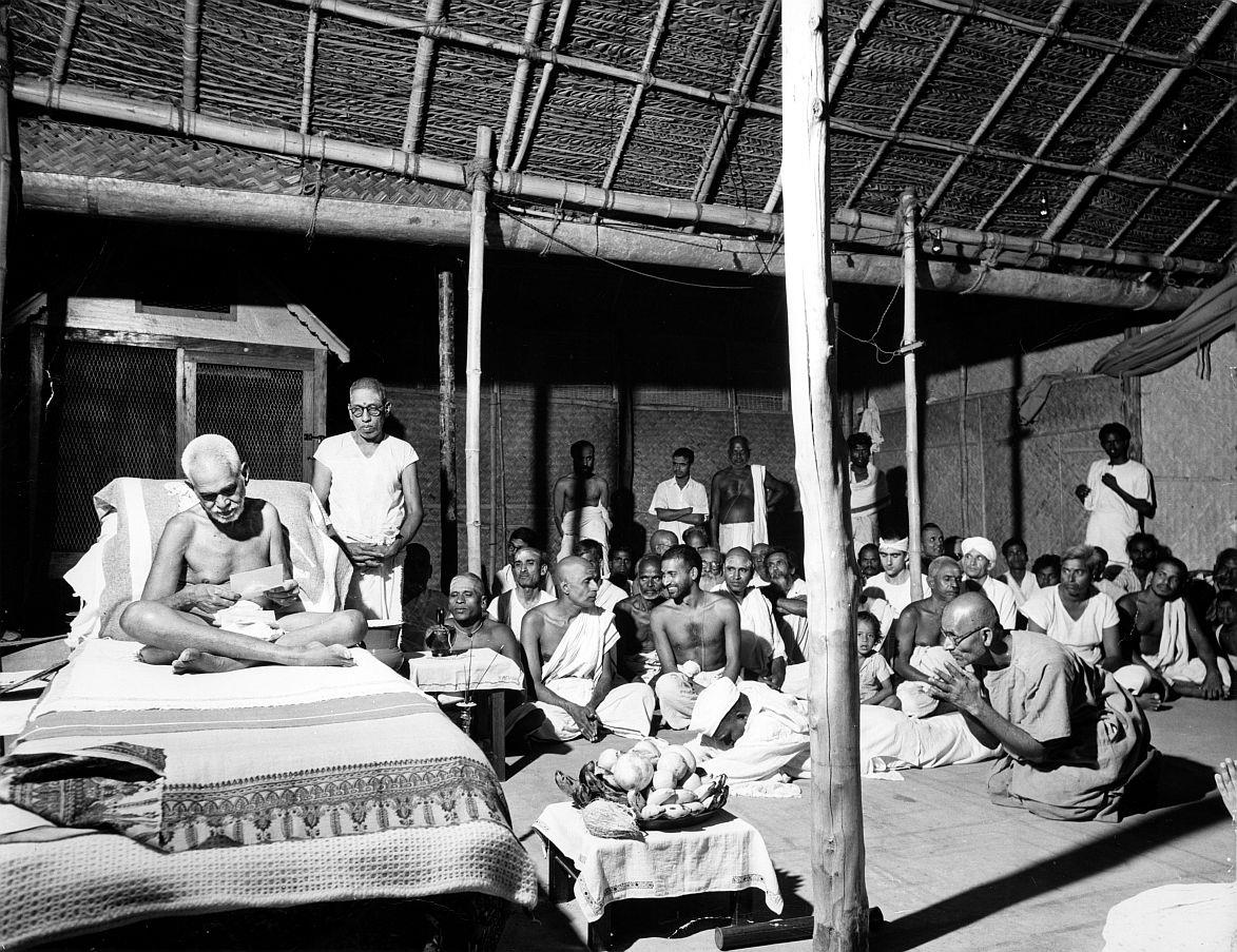 ‘…..devotees in the Presence of Sri Bhagavan…..’