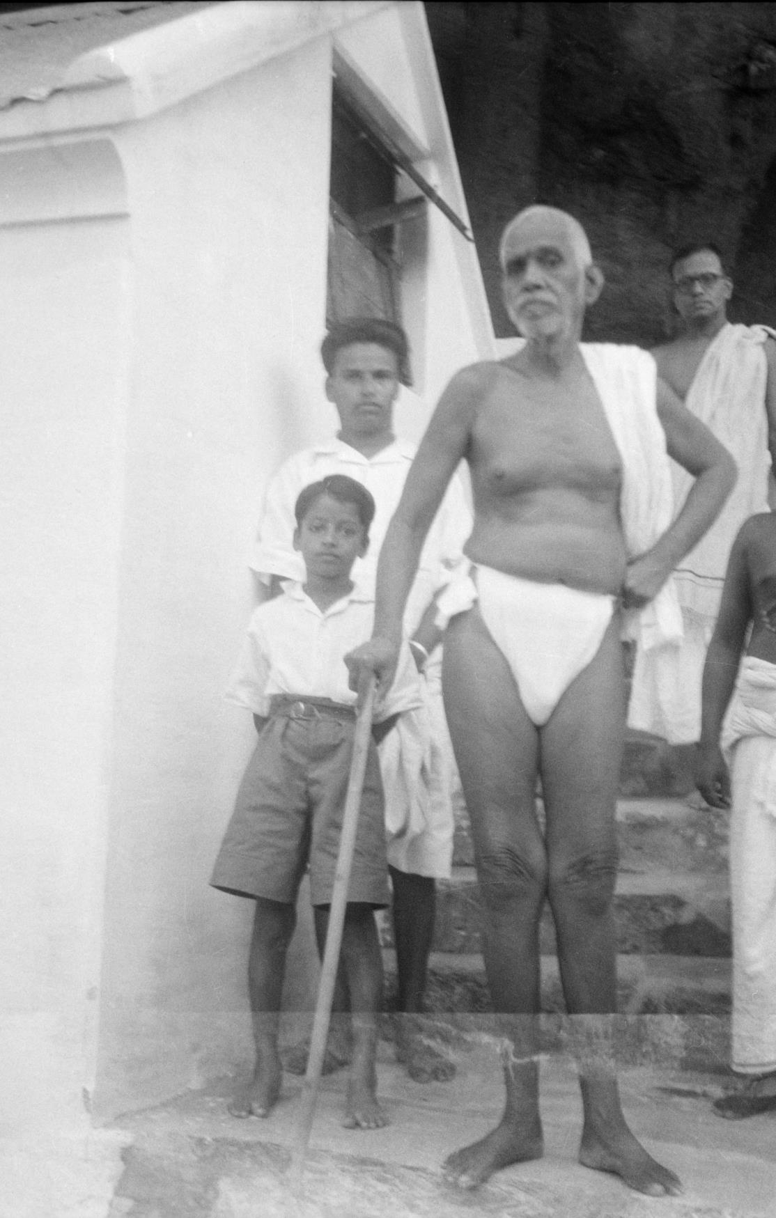Sri Bhagavan at Skandasramam - Ganesan with his father and T.P.Ramachandra Iyer - (standing behind )