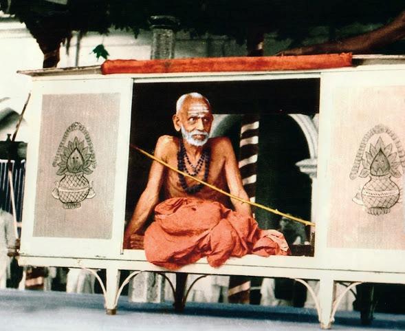 Paramacharya seated inside the Mena (“cramped wooden box”)