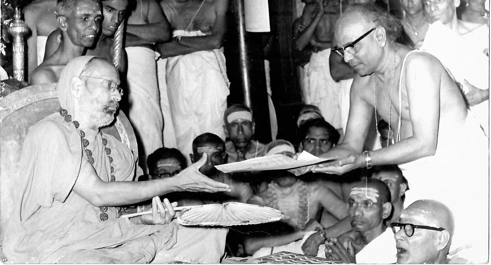 Embar Vijayaraghavachariar being honoured by his Holiness for his performing harikatha [exposition ] on “Ramana Vijayam” [ Life and Teachings]