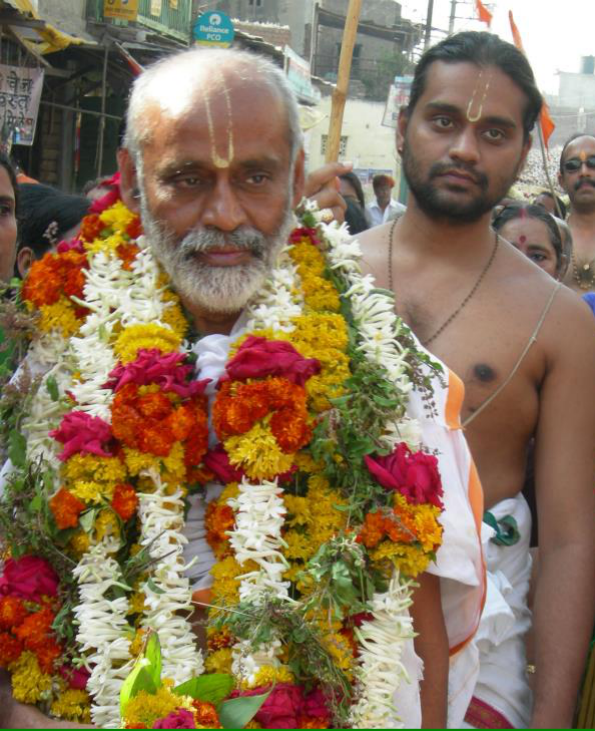 Younger son Sri Rangan devoutly following his father