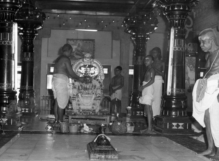 Shastri Mama at Bhagavan’s Samadhi shrine (extreme right)