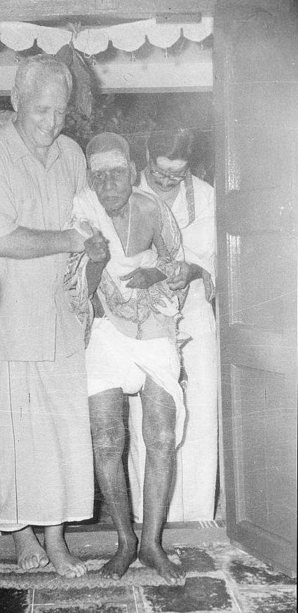 Shastri Mama entering the Old Hall assisted by Hugo Maier