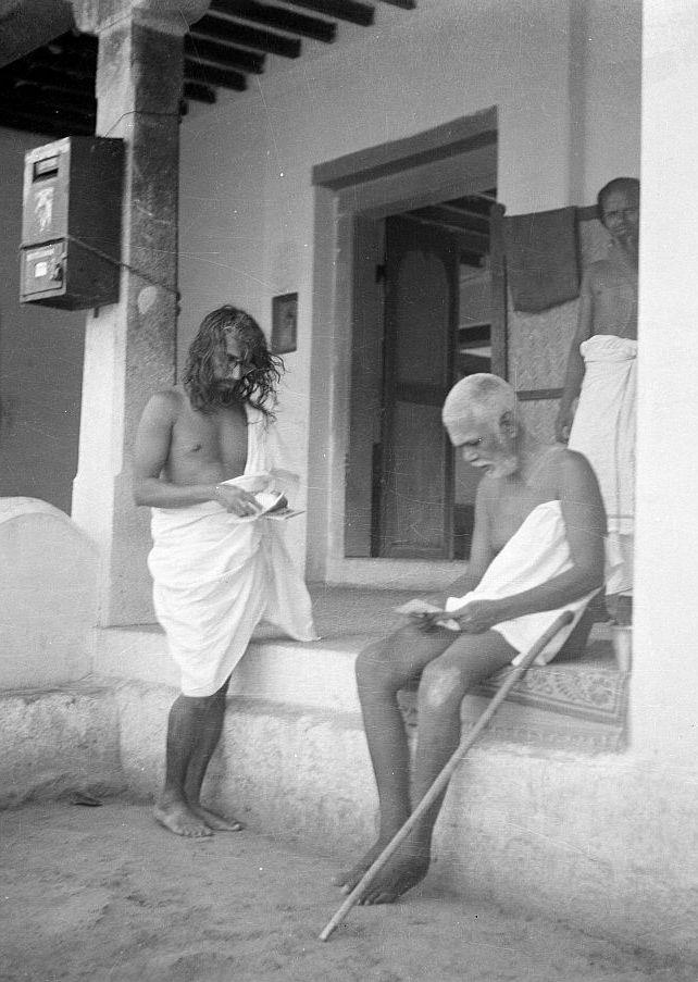 Bhagavan reading letters in front of Ramanasramam Post Office