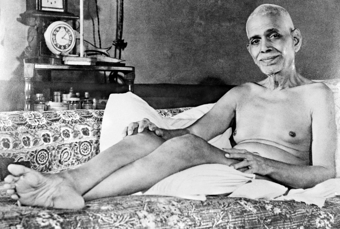 Bhagavan reclining on the couch in the Old Hall