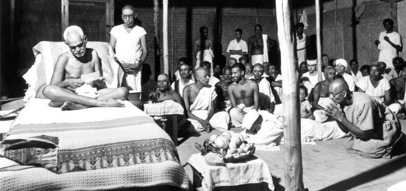 Bhagavan reading one of G.V. Subbaramayya’s letter
