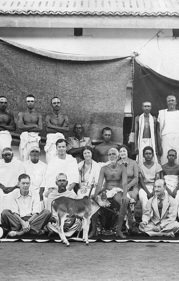 Paul Brunton seated to the left of Sri Bhagavan