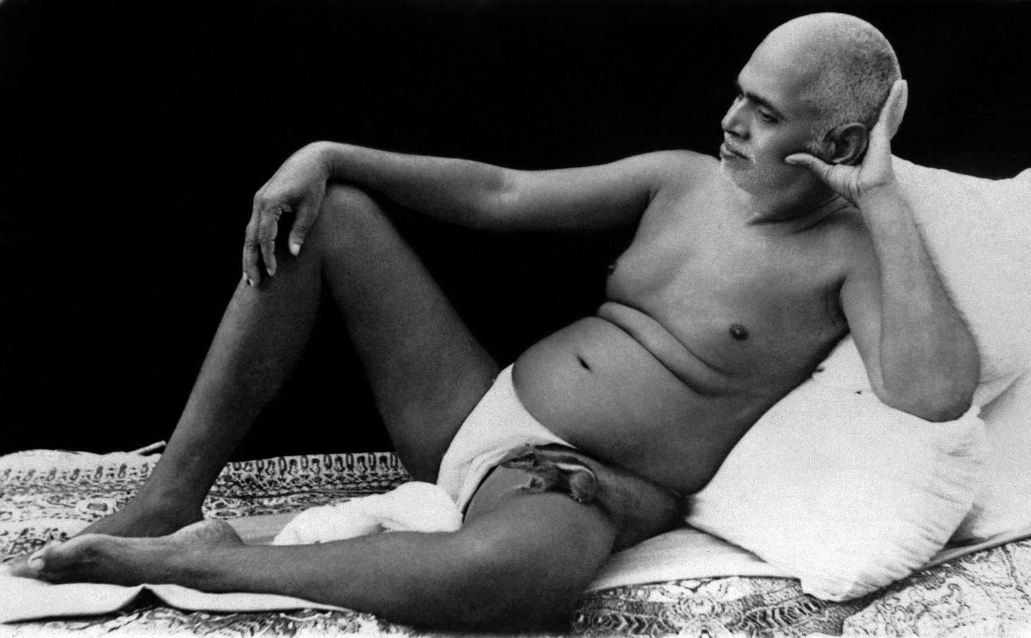 Notice the baby squirrel on Bhagavan’s lap