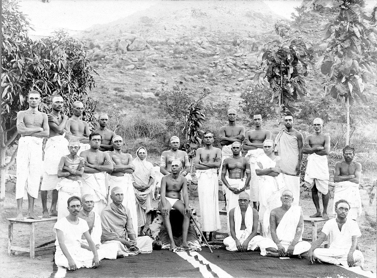 Santhammal standing behind Sri Bhagavan