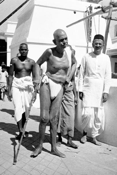 Walking near the Ashram well (l to r) Vaikuntavasar, Sri Bhagavan, Dr. M. Anantanarayana Rao