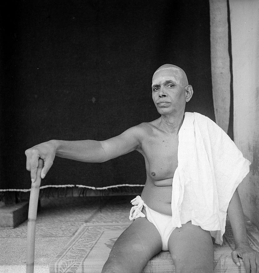 Sri Bhagavan seated at the entrance to the Goshala