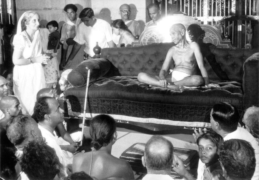 Sri Bhagavan giving darshan in the ‘New Hall’ (Ganesan can be seen in the foreground, right)