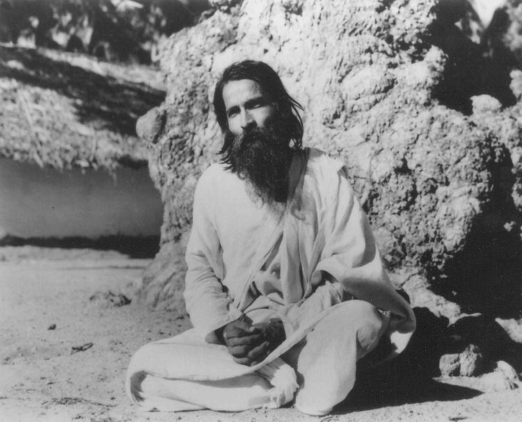 Yogi Ramsuratkumar seated under the ‘Illupai Tree’ at the Ashram entrance