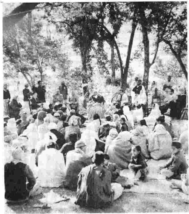 Swami Chidananda (seated on Swamiji’s left) lectures at the Forest University