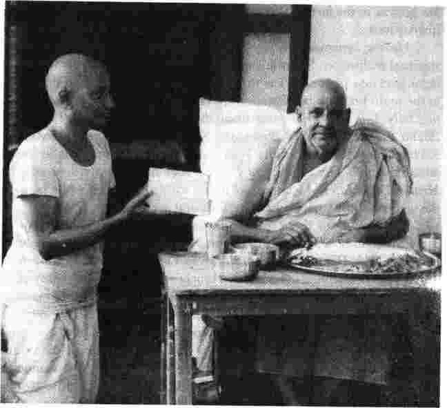 Swamiji receives the first copies of a new book
