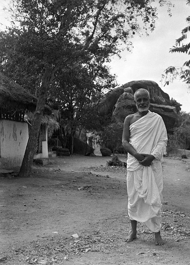 photograph: Munagala Venkataramiah standing before the Stone Cave, Palakottu