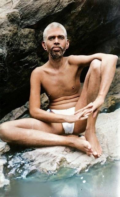 photo of Sri Bhagavan seated at Skandashram behind the spring in the rock