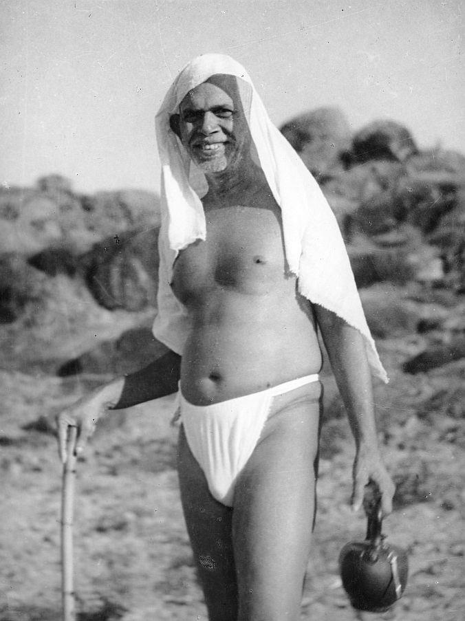 photo of Sri Bhagavan putting His towel on His head