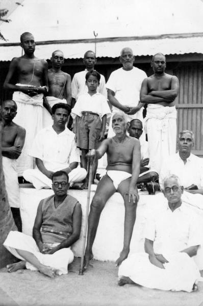 group seated and standing around Sri Bhagavan