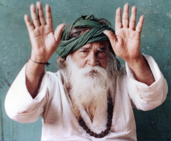 Yogi Ramsuratkumar with raised palms
