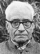 black-and-white portrait of an elderly man in glasses (Prof. K. Swaminathan per caption)