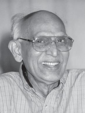 portrait photo of smiling bald man in glasses