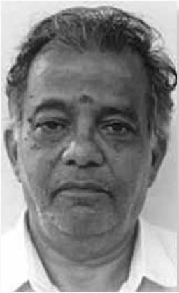 portrait photo of man with tilak mark on forehead
