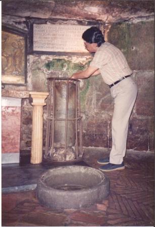 photo of Ganesan at the Miracle Well in the underground cellar